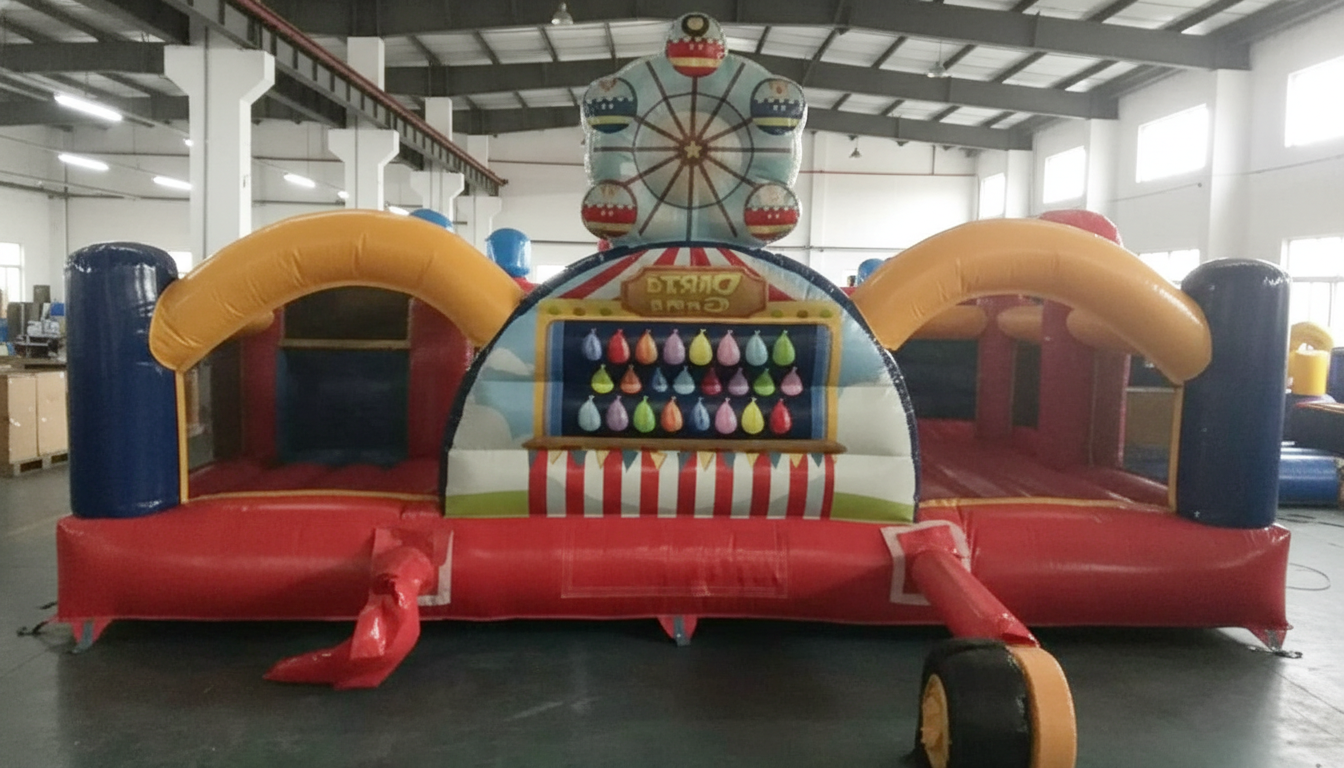 Colorful inflatable carnival game with dartboard and balloons in an indoor setting.