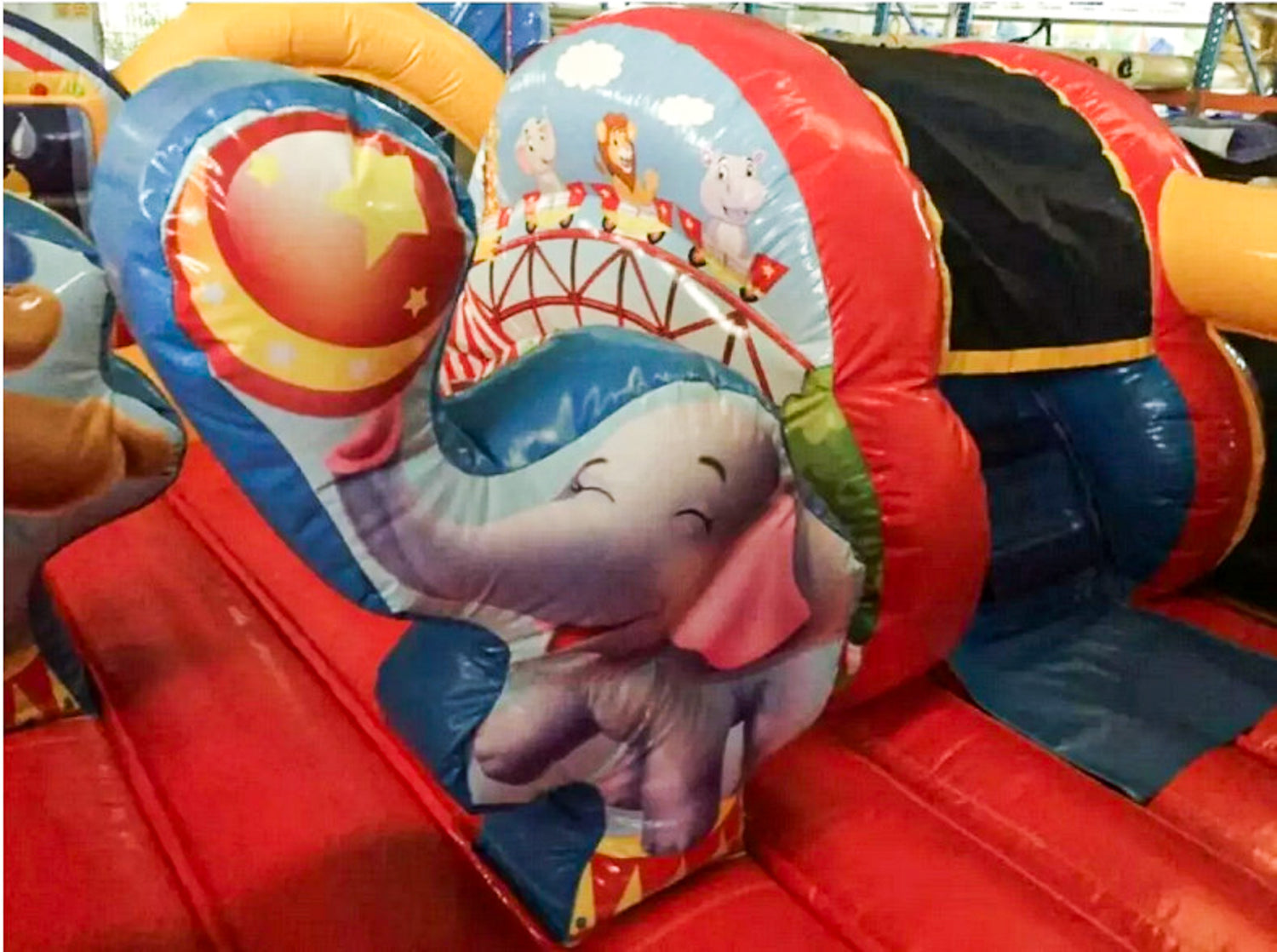 Colorful inflatable slide with cartoon character on a playground