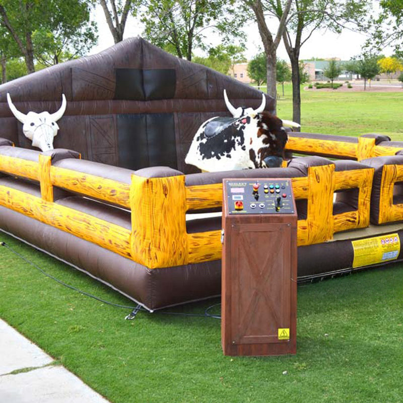 Inflatable mechanical bull riding game with a bull and rider figure, made of commercial grade PVC, requiring a blower for operation.
